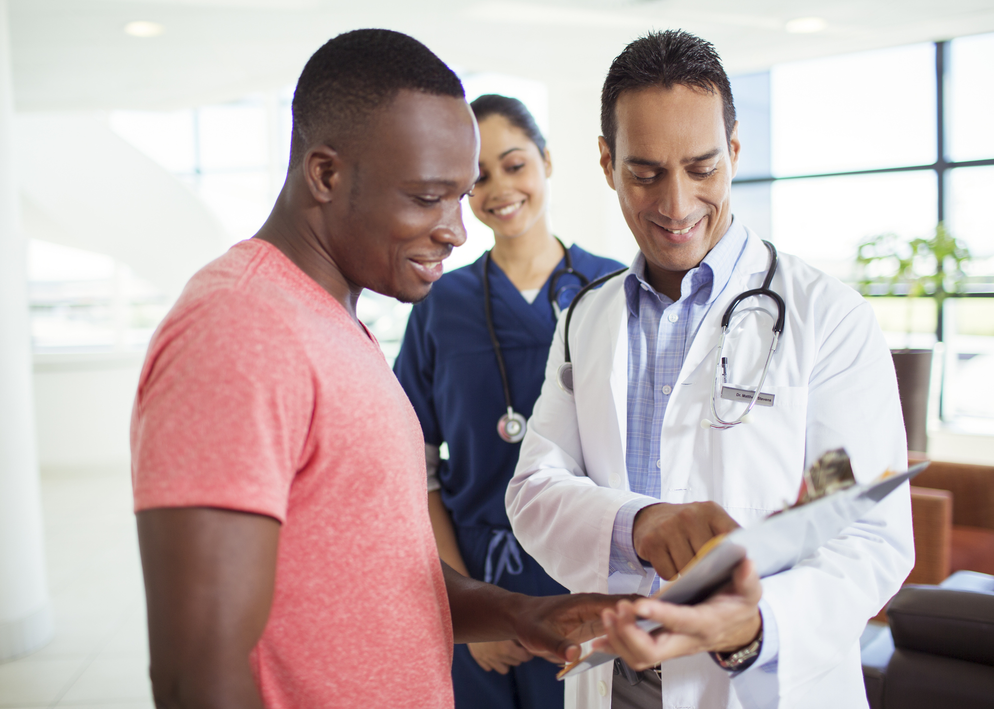 Doctor talking to adult patient