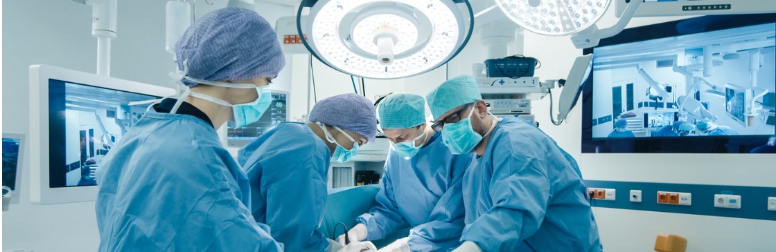 Medical Team Performing Surgical Operation in Bright Modern Operating Room