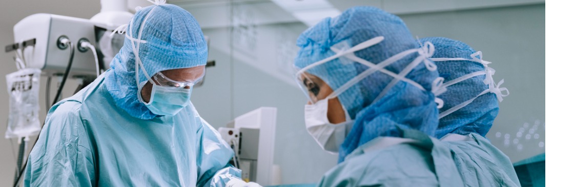Surgeons doing knee reconstruction surgery in hospital operation room. Surgical team performing a knee surgery on patient in operation room.